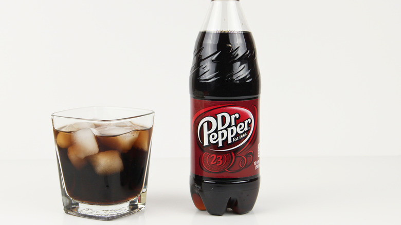 Bottle of Dr Pepper and cup