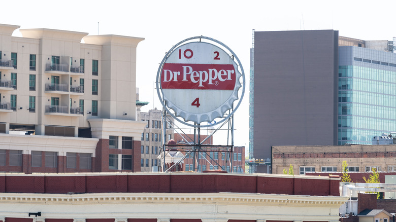 Closeup view of downtown city in Virginia business office building sign for Dr Pepper