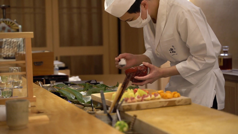 Chef cooking in kappo restaurant 