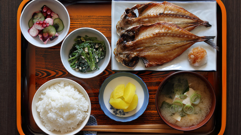 A tray with multiple small dishes