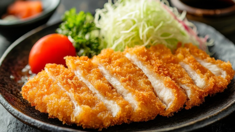 sliced chicken cutlet with salad