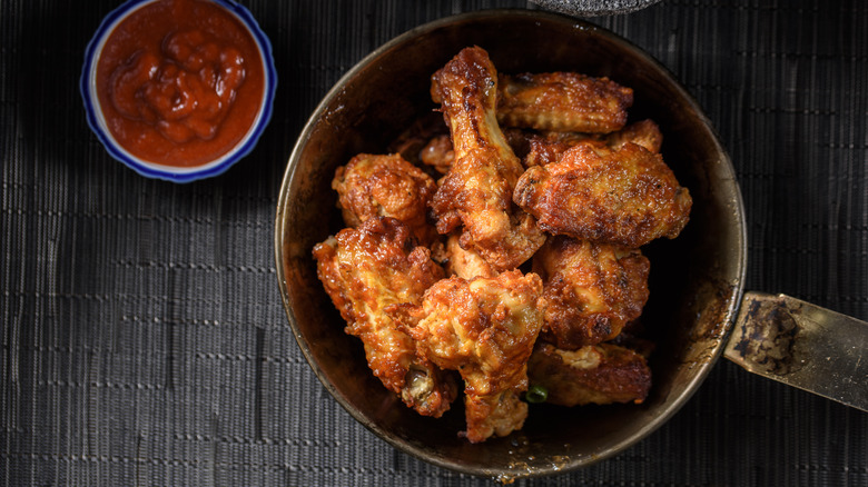 chicken wings in steel pan