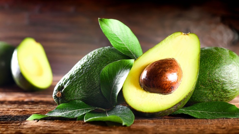 Sliced avocado on wooden table