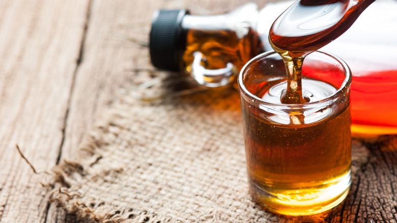 maple syrup dripping from spoon