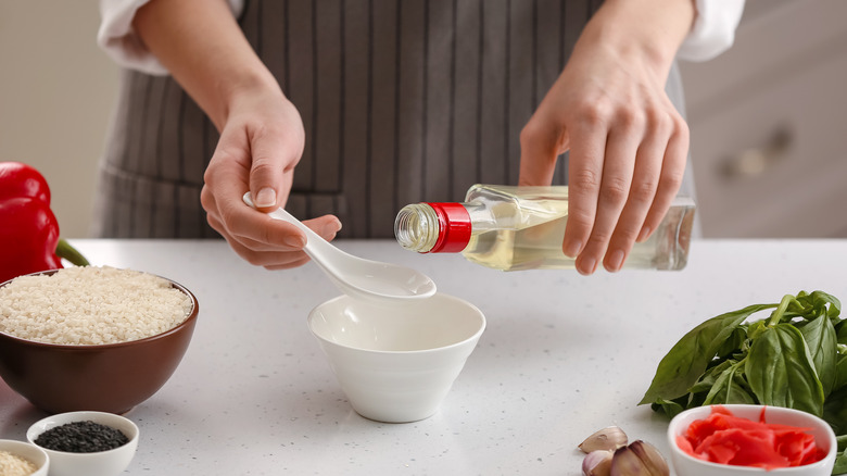 pouring vinegar onto spoon