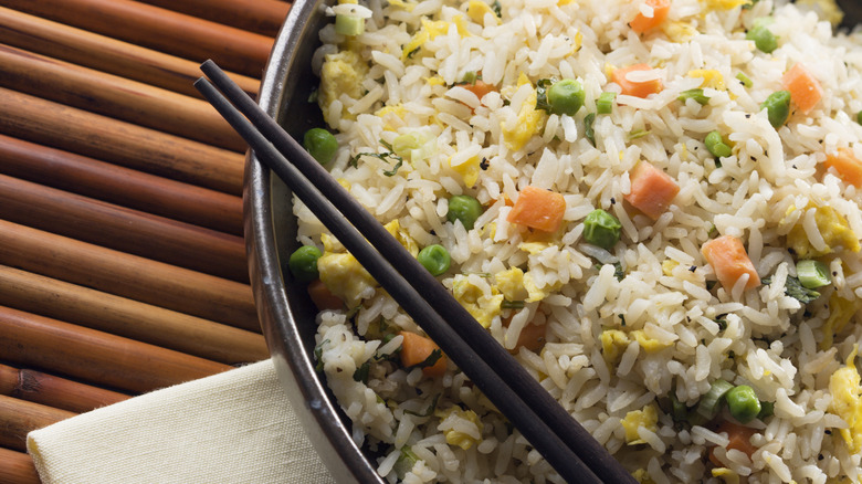 bowl of fried rice with chopsticks