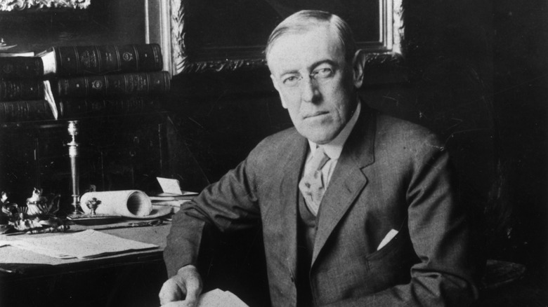 Woodrow Wilson seated at desk