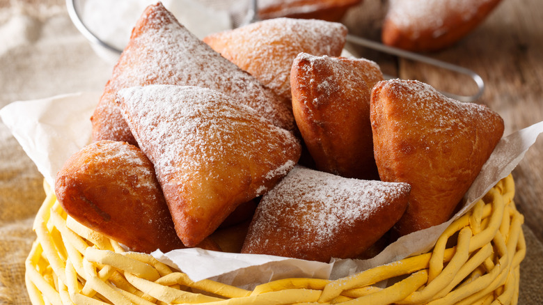 mandazi in basket with sugar