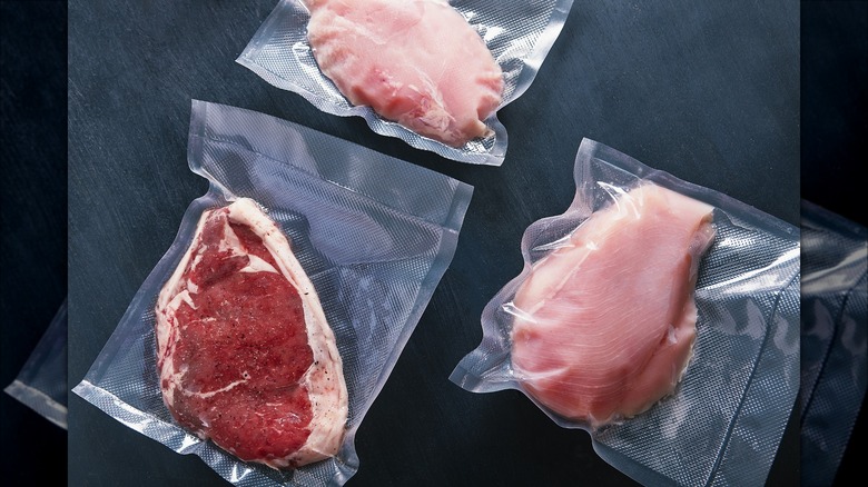 vacuum-sealed bags with raw meat