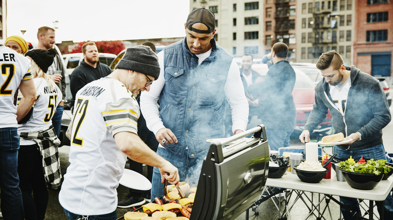 men wearing jerseys tailgating