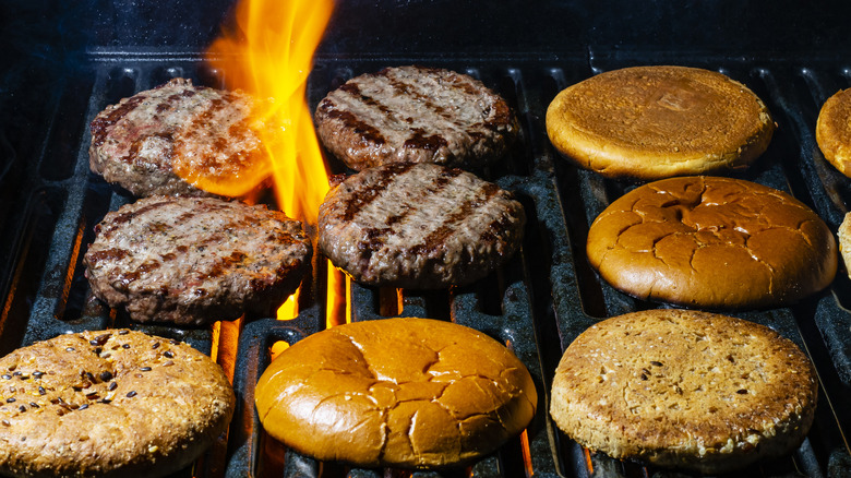 burgers and buns on grill