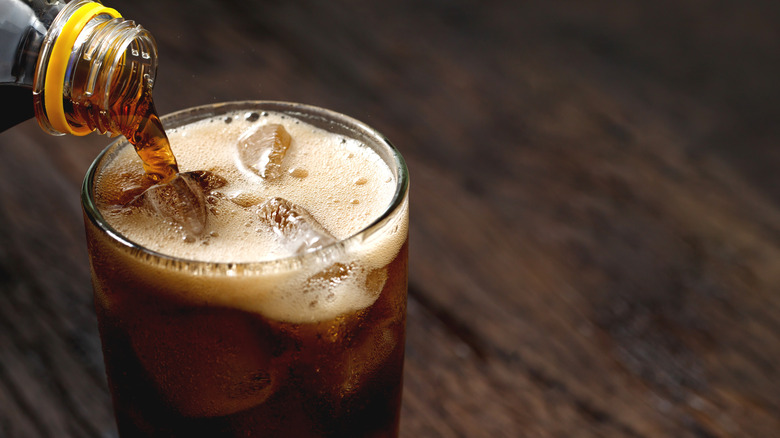 Glass of soda being poured