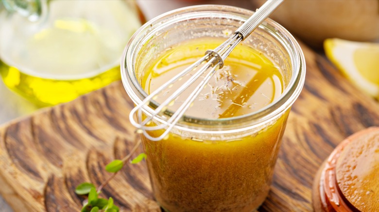 vinaigrette in jar with whisk