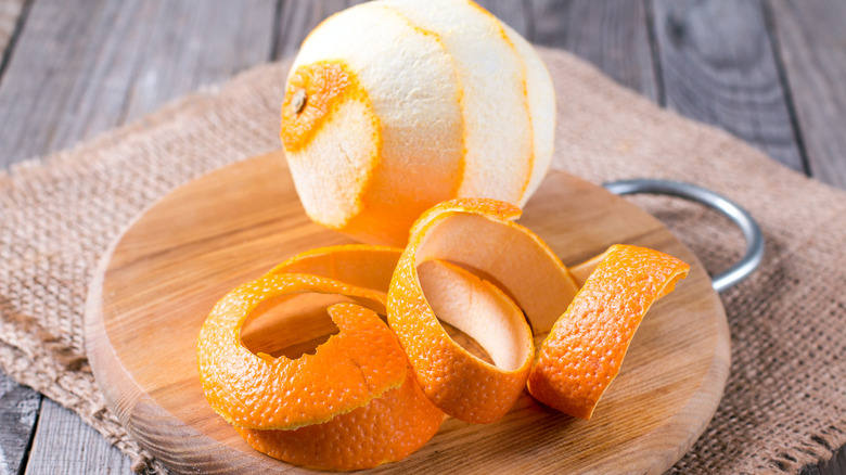 Citrus peel on wooden board