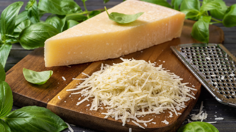 block of Parmesan cheese shredded