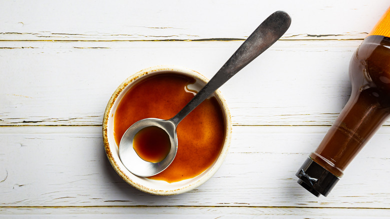 worcestershire sauce in bowl with spoon