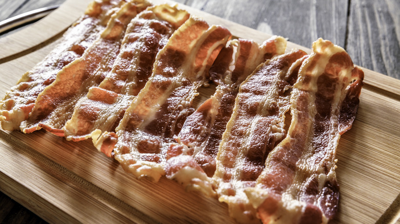 roasted bacon on cutting board