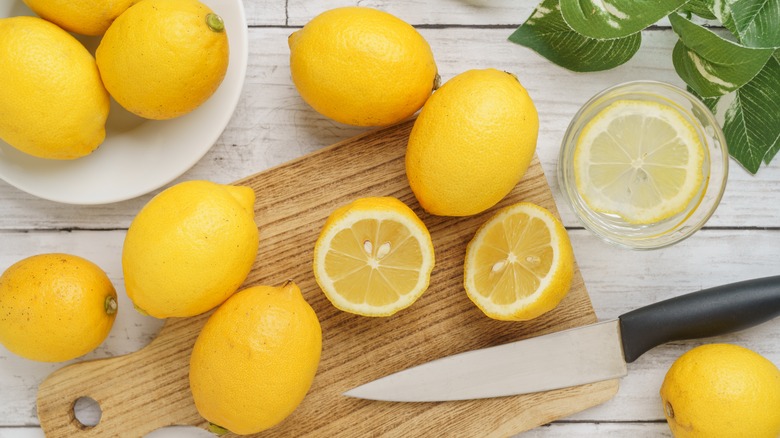 lemons being sliced on board