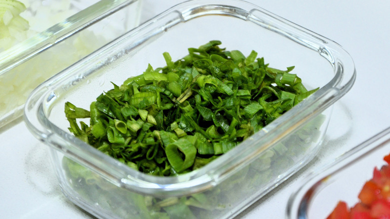 Chopped chives in glass dish