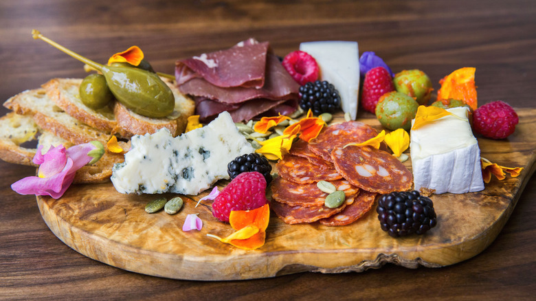 charcuterie board with flowers