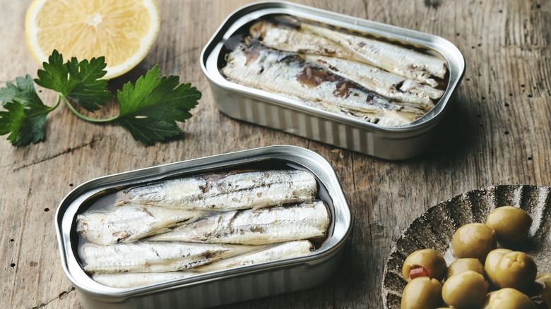 tins of fish with olives