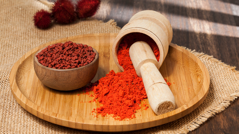 Ground achiote powder on board