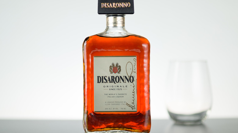 bottle of disaronno and glass