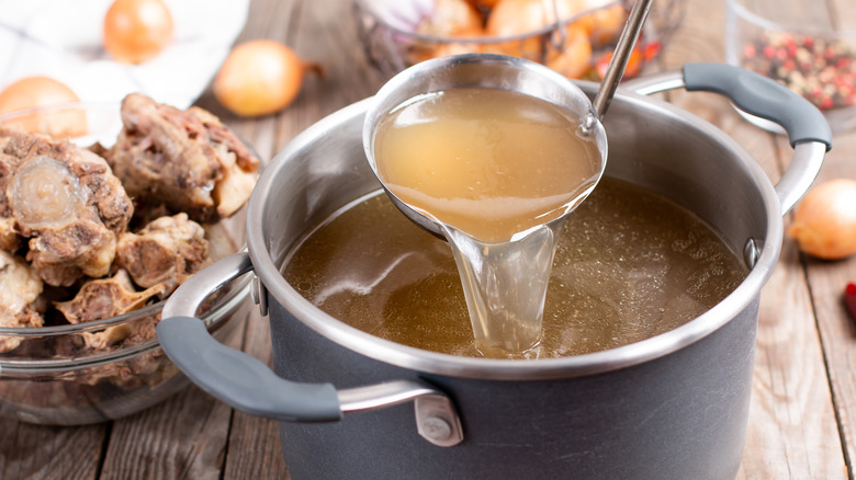 Ladle of homemade stock