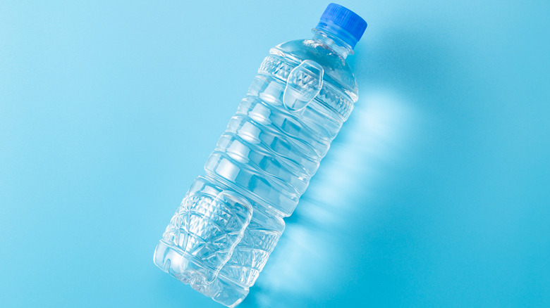 Bottled water on blue background