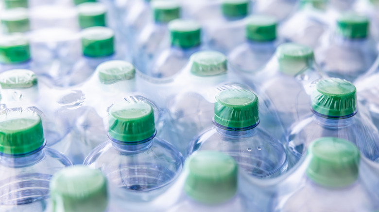 Rows of plastic bottles in plastic packaging