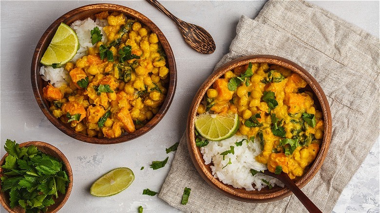 chickpea curry in bowls with lime