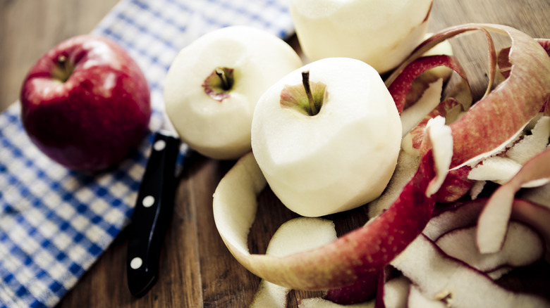 peeled apples on table