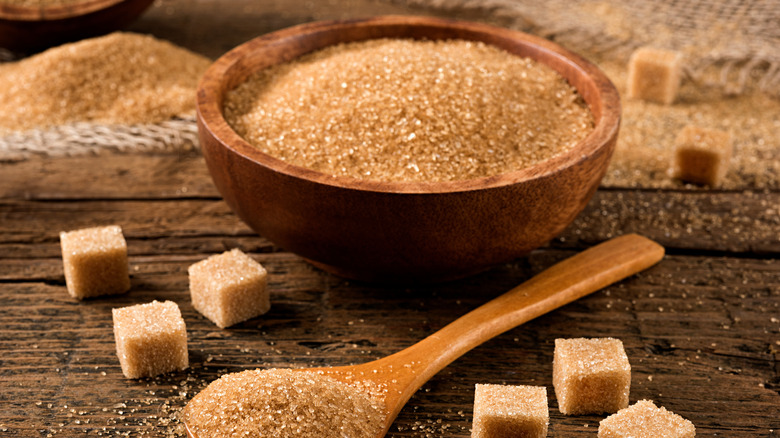 Bowl, cubes, and spoonful of brown sugar