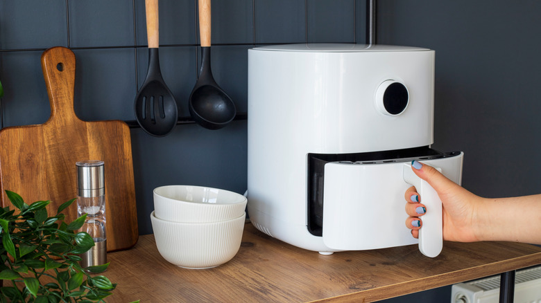 White air fryer sitting on kitchen countertop