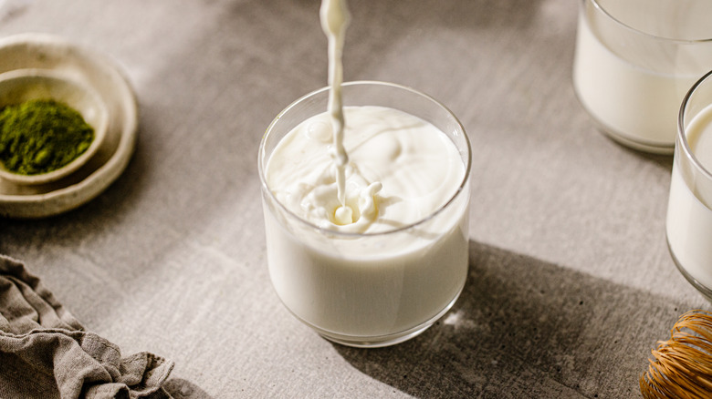 milk being poured into glass