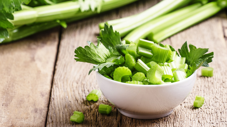 cut celery in white bowl