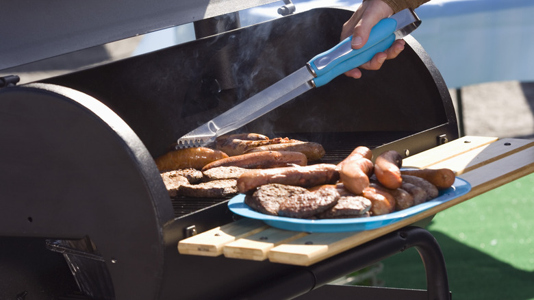 removing meat from open smoker