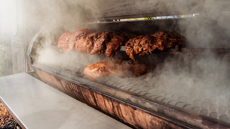 meat being smoked in smoker