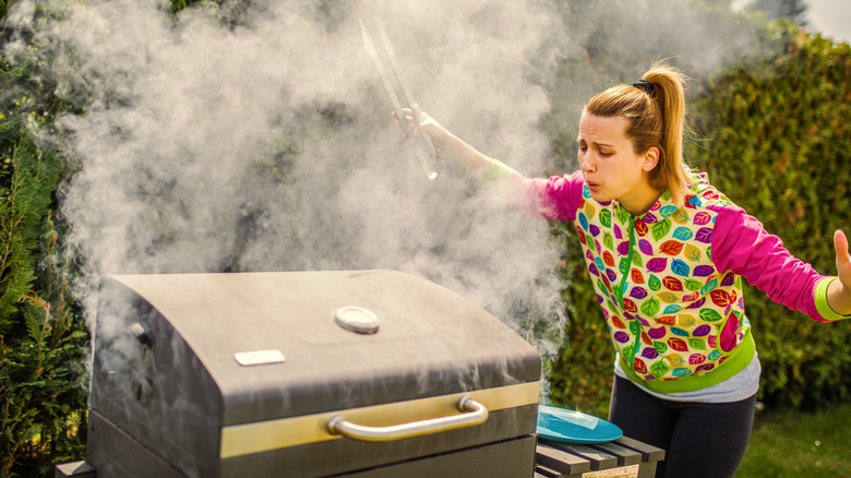 person with smoky barbecue