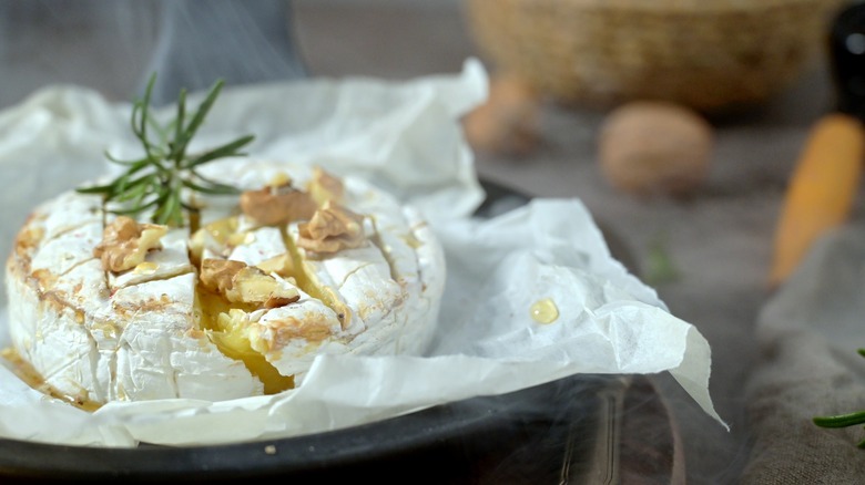 Baked brie with walnuts and herbs