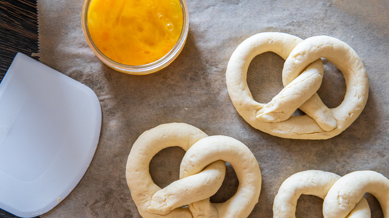 Egg wash and raw pretzels