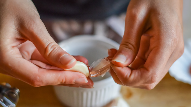 peeling garlic clove