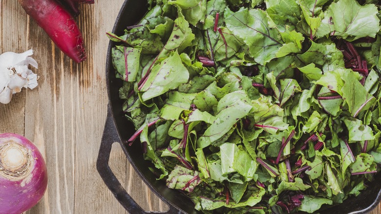 Beet greens in cast-iron pan