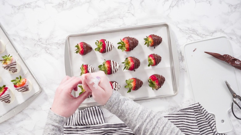 Piping designs on dipped strawberries