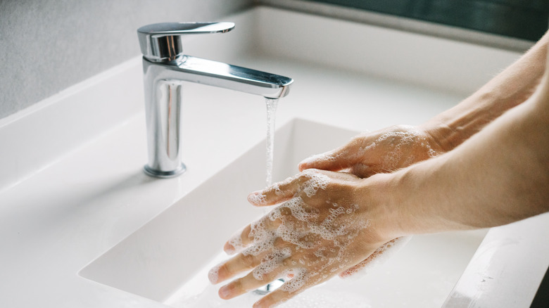 person washing hands