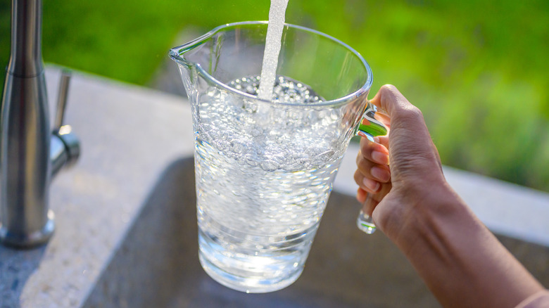 Filling jug of water