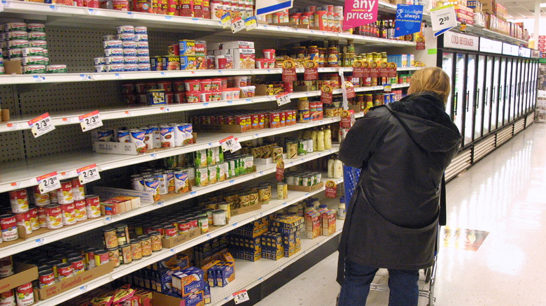 woman in Walmart grocery aisle