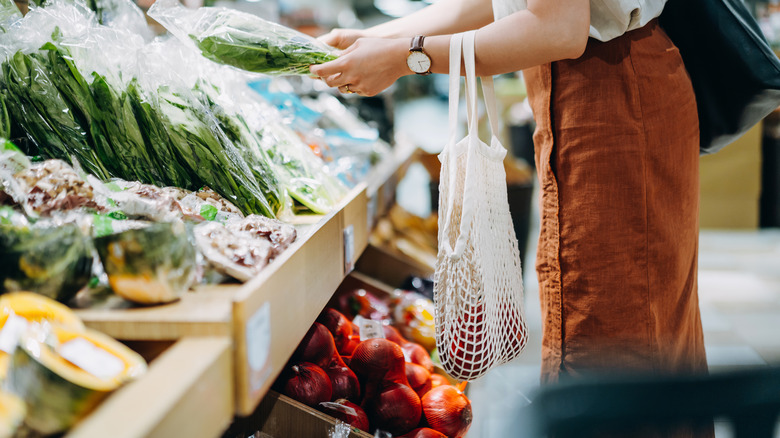 person buying fresh produce