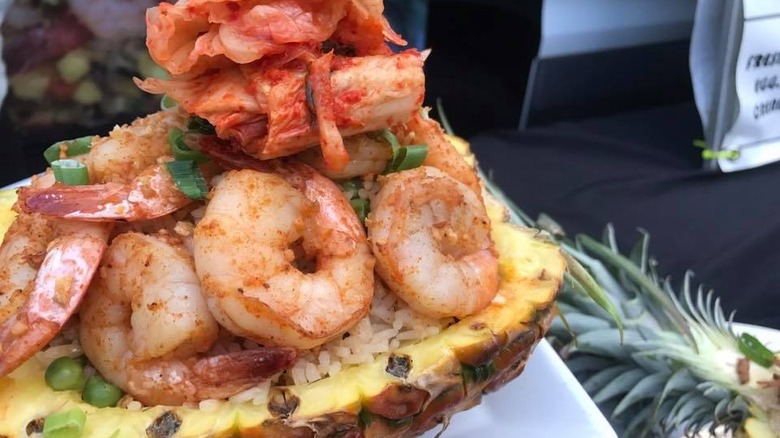 Shrimp and toppings on pineapple