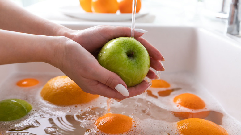 fruit being washed with soap